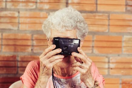 Elderly woman taking profile selfie funny