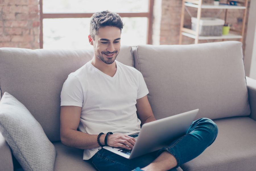 Interracial Dating Man Browsing Laptop